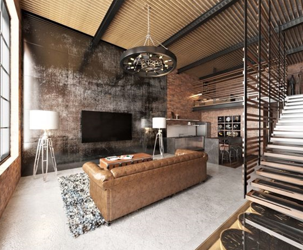 Modern industrial loft featuring exposed brick walls, a leather sofa, and a metal staircase