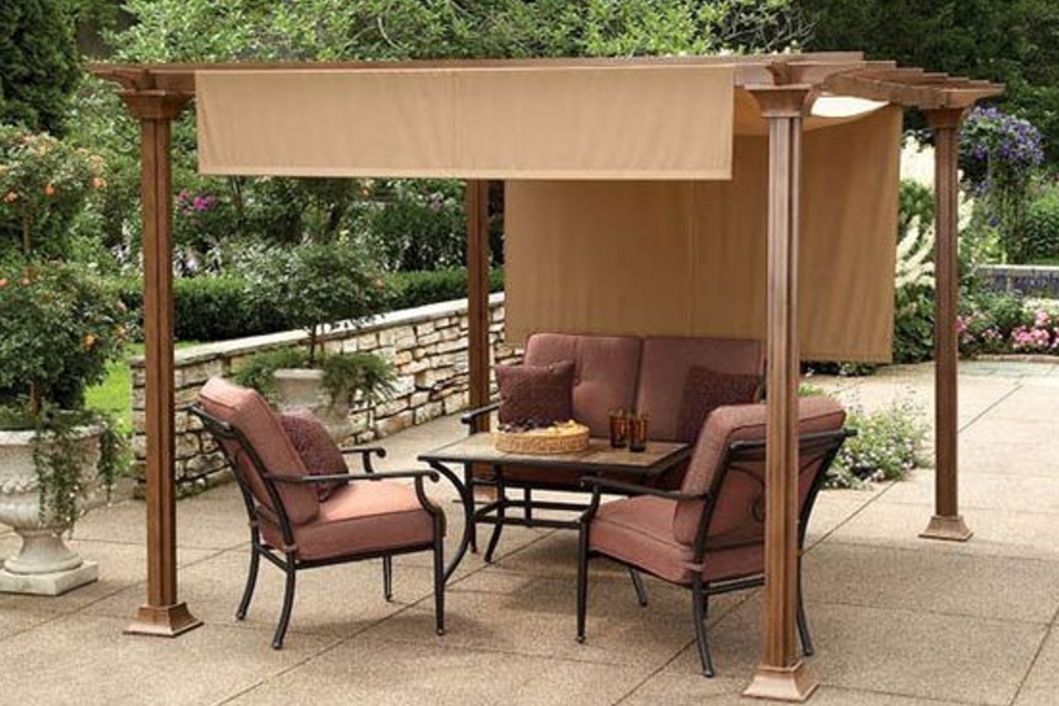 Outdoor patio with a canopy, seating area, and a small table set with drinks