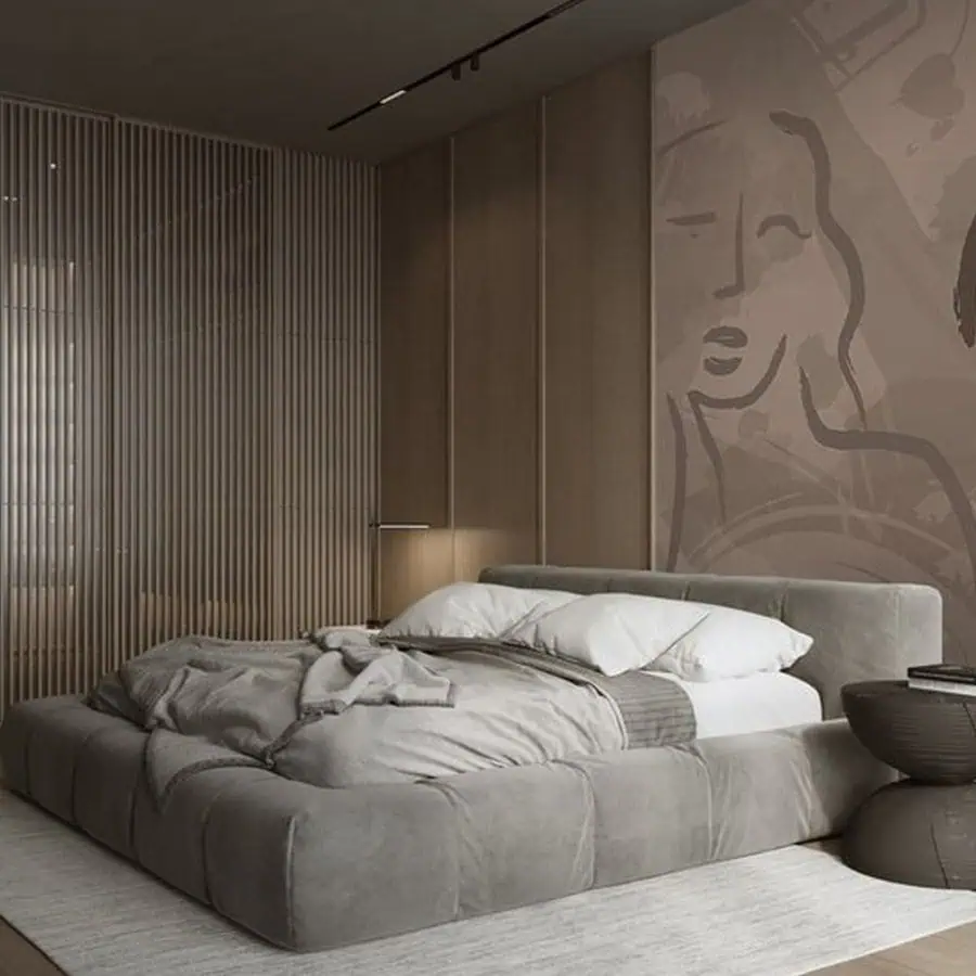 Modern bedroom with a low, gray bed, abstract wall art, and minimalist decor.