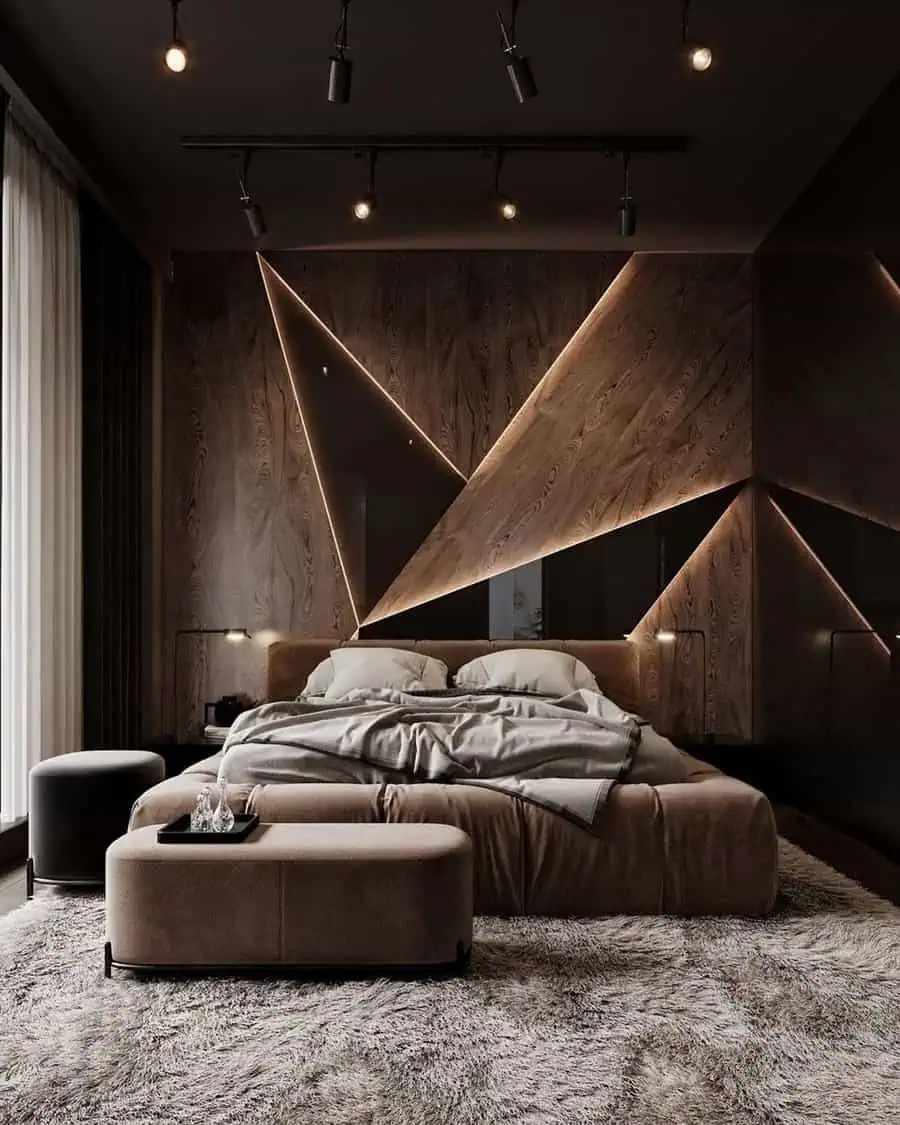 Modern bedroom with geometric wall design, ambient lighting, and cozy furnishings.