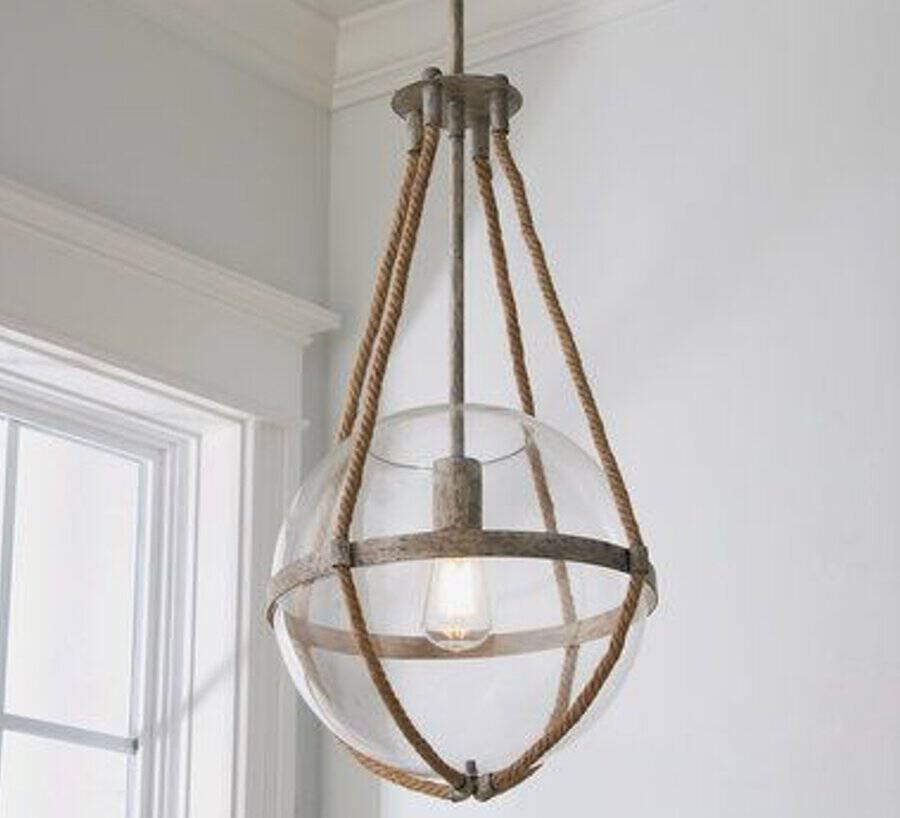 Hanging glass sphere light fixture with metal accents and rope design