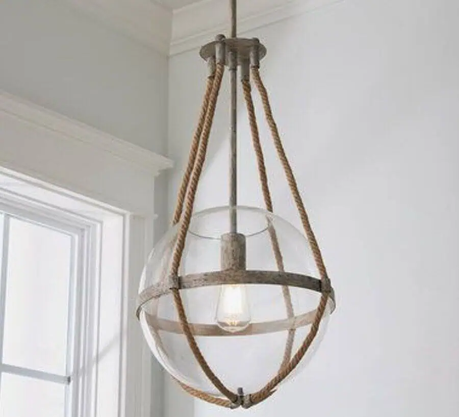 Hanging glass sphere light fixture with metal accents and rope design