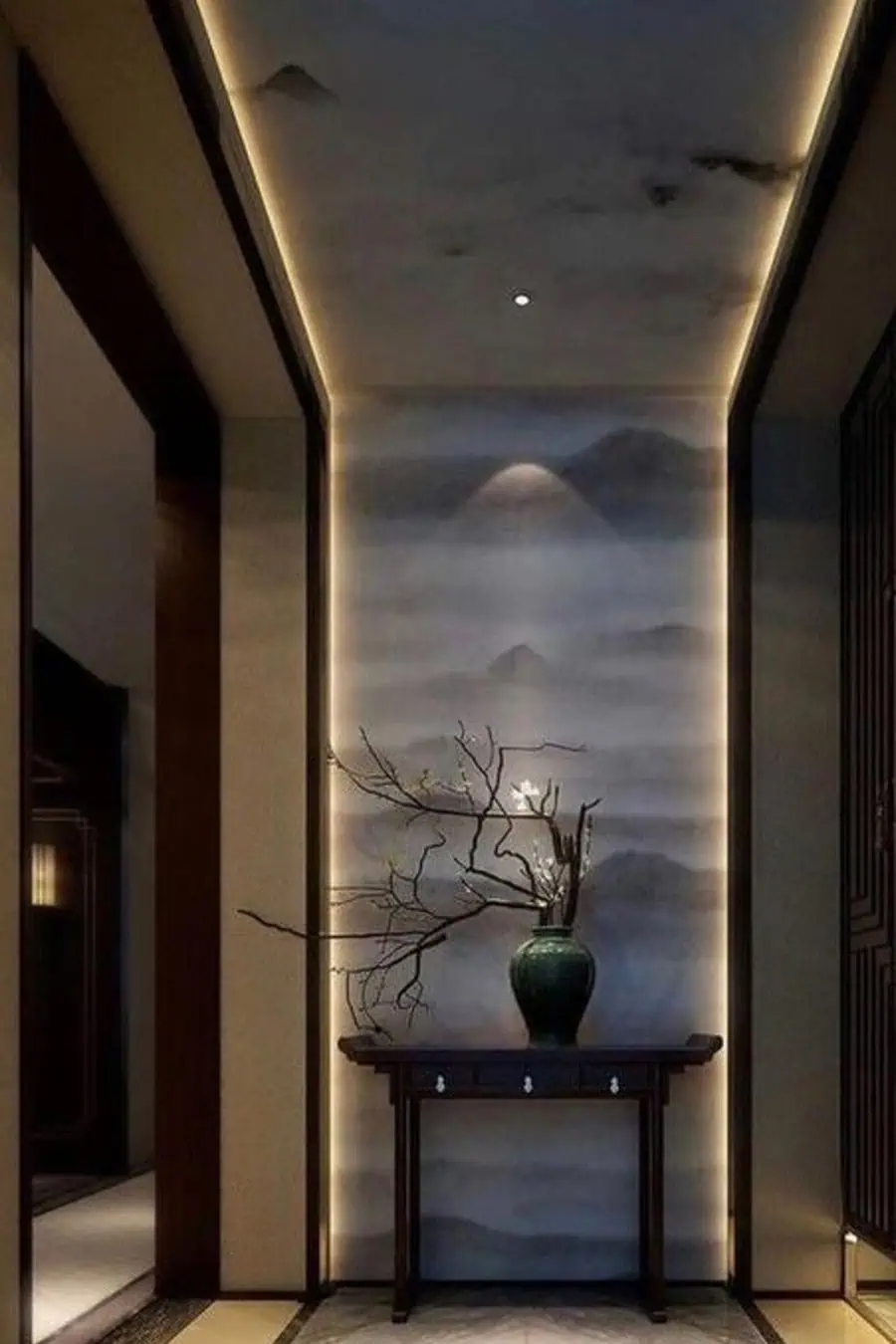 Elegant hallway with a vase holding delicate branches on a wooden table set against a softly lit misty mountain mural