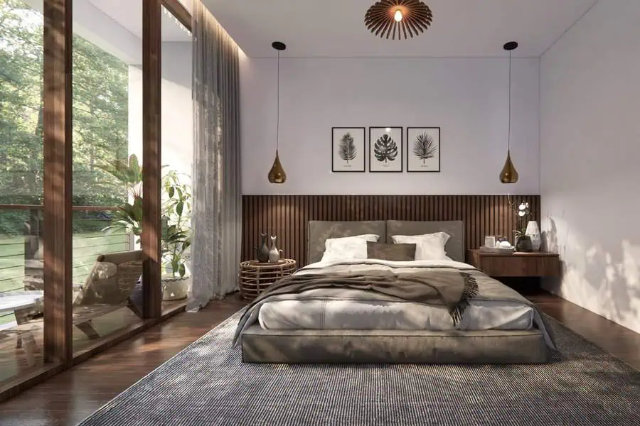 Modern bedroom with large windows, a cozy bed, nature-themed wall art, and warm lighting.