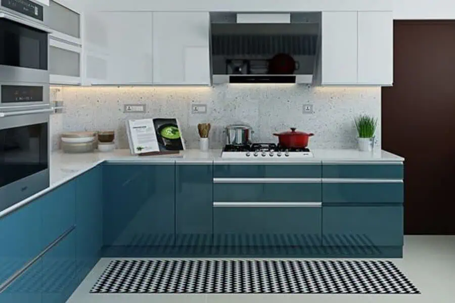 A modern kitchen with glossy teal lower cabinets, white upper cabinets, and a black-and-white checkered runner rug.