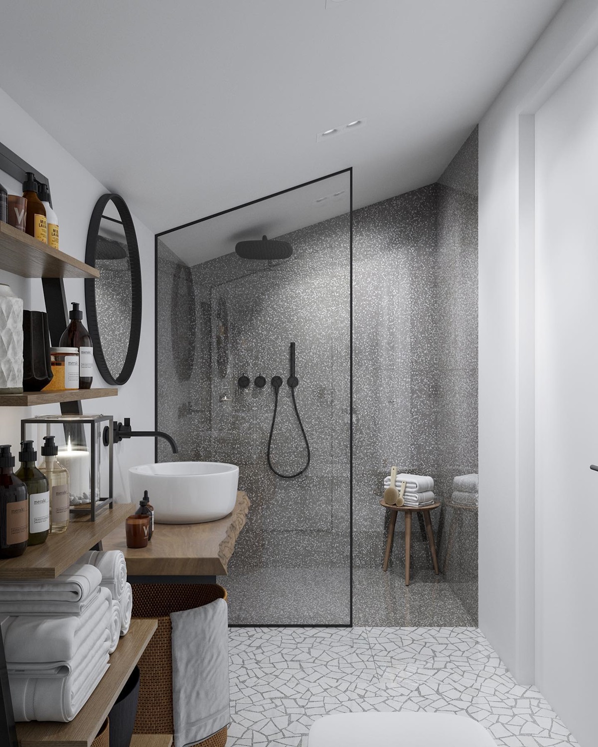 Modern bathroom with glass-enclosed shower, floating shelves, and mosaic tile floor