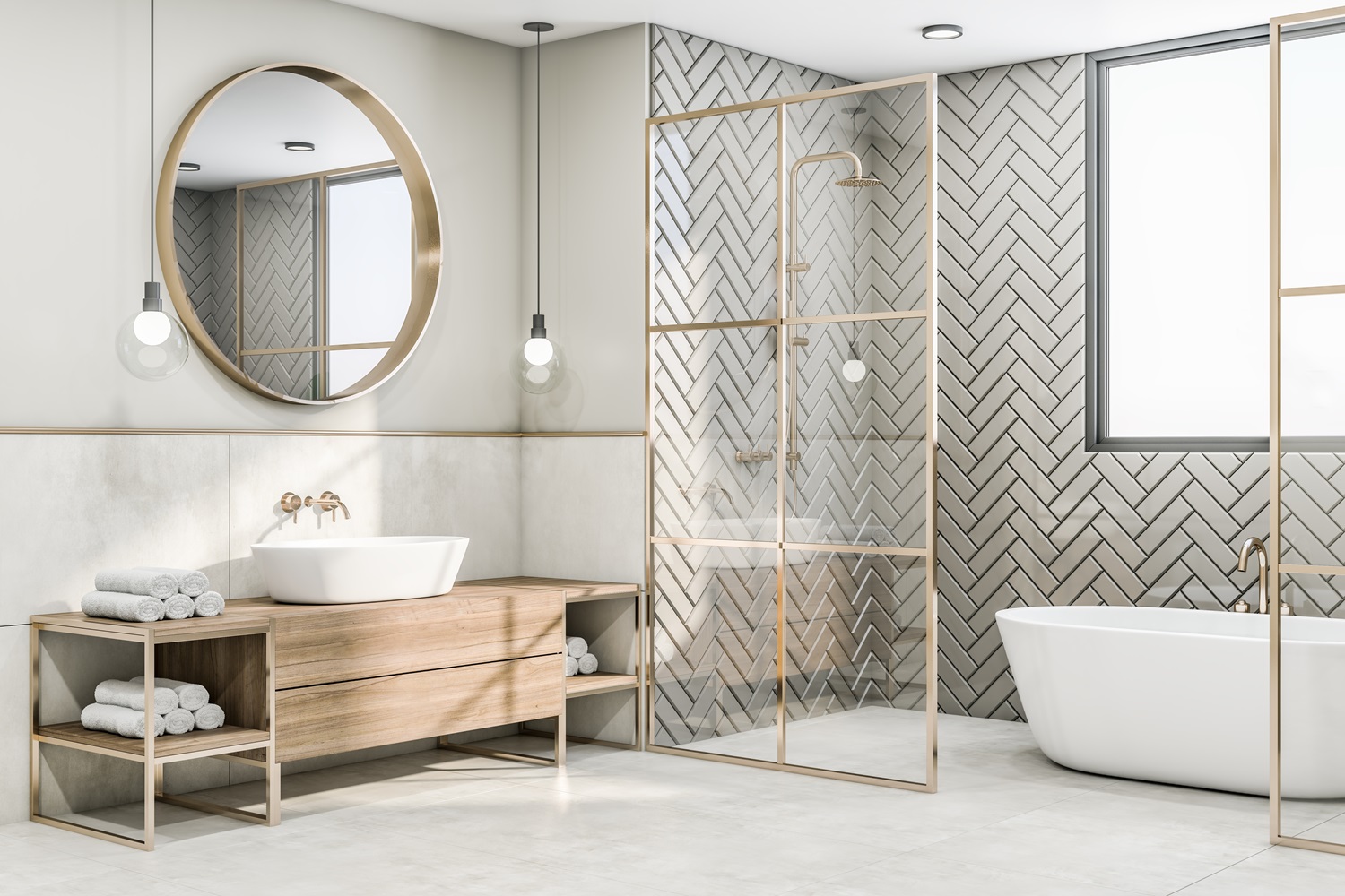 Modern bathroom featuring gold accents, herringbone tiles, round mirror, and freestanding tub