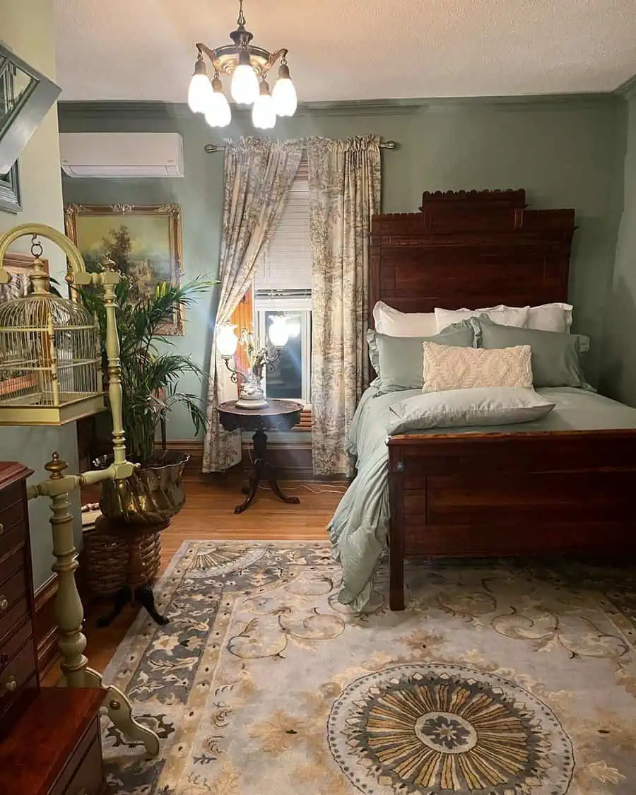 A cozy bedroom featuring a wooden bed with green bedding, floral curtains, vintage decor, an ornate rug, and soft lighting