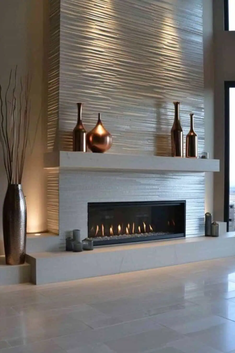 Sleek modern fireplace with a textured feature wall, minimalist mantel, and elegant metallic decor.