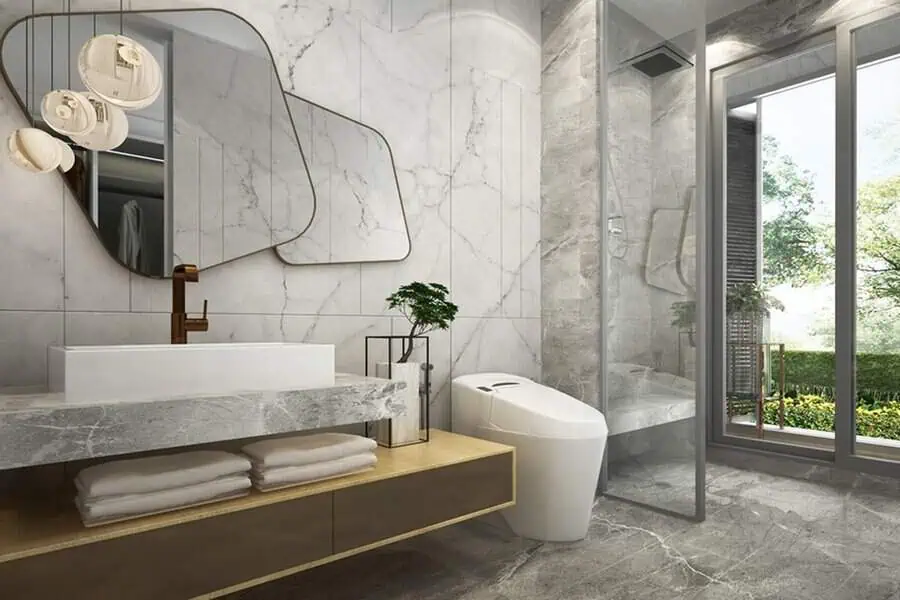 Contemporary Art Deco bathroom with geometric mirrors, marble vanity, and a minimalist design.