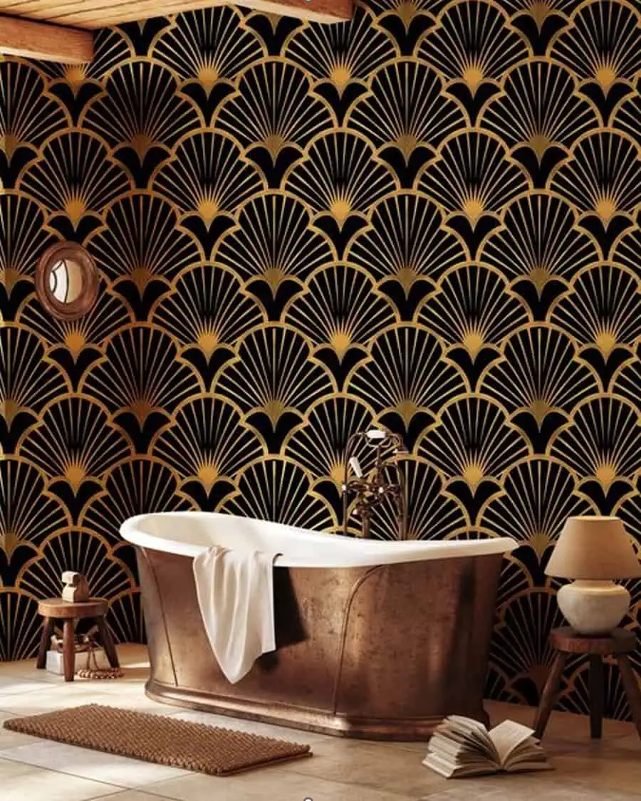 Art Deco bathroom with black and gold fan-patterned wallpaper and a copper freestanding bathtub.