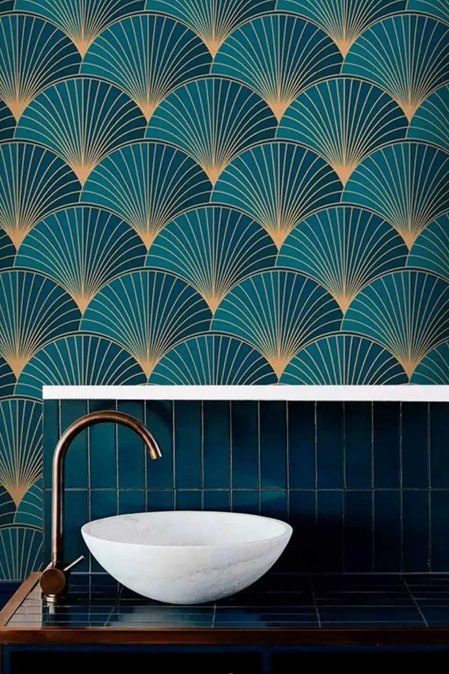 Art Deco bathroom with teal and gold fan-patterned wallpaper and a modern white vessel sink.