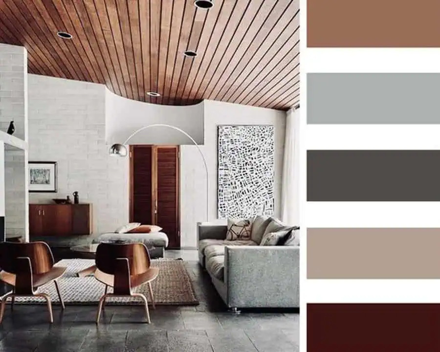 Modern living room with wooden ceiling, neutral tones, and matching color palette.