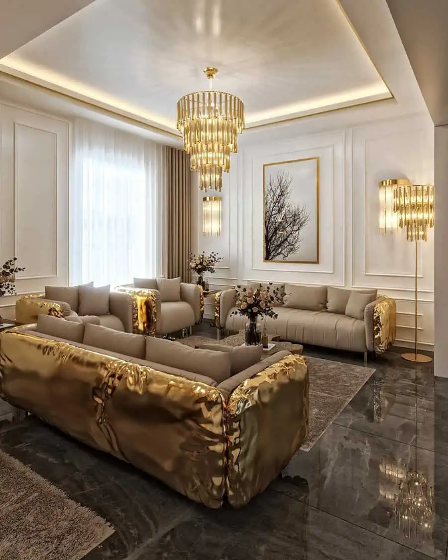 Luxurious living room with gold-accented furniture, chandelier, and modern decor.