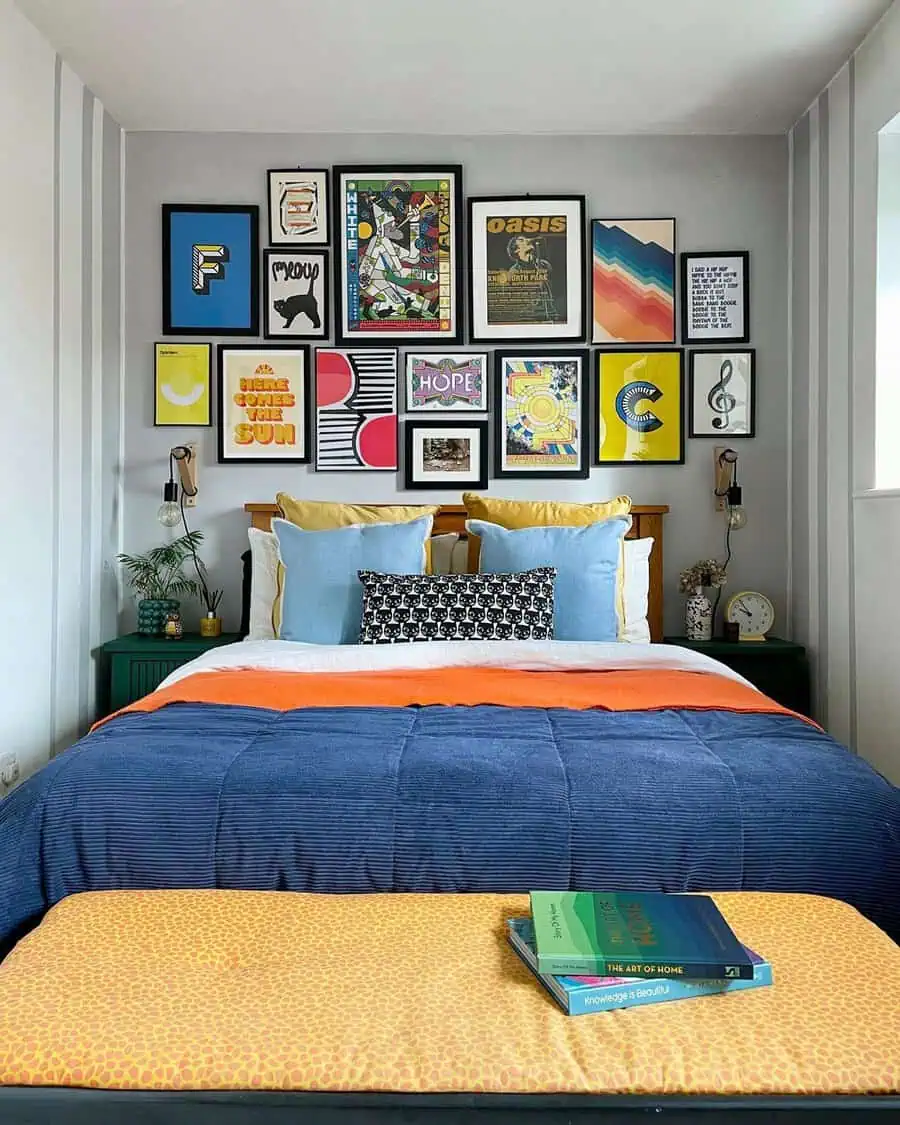 Colorful gallery wall above bed with bold patterns and bright bedding in a cozy bedroom.