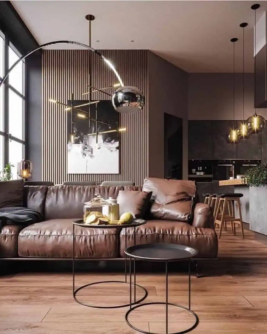 Scandinavian-inspired living room with a leather couch, minimalist side tables, and modern lighting fixtures.