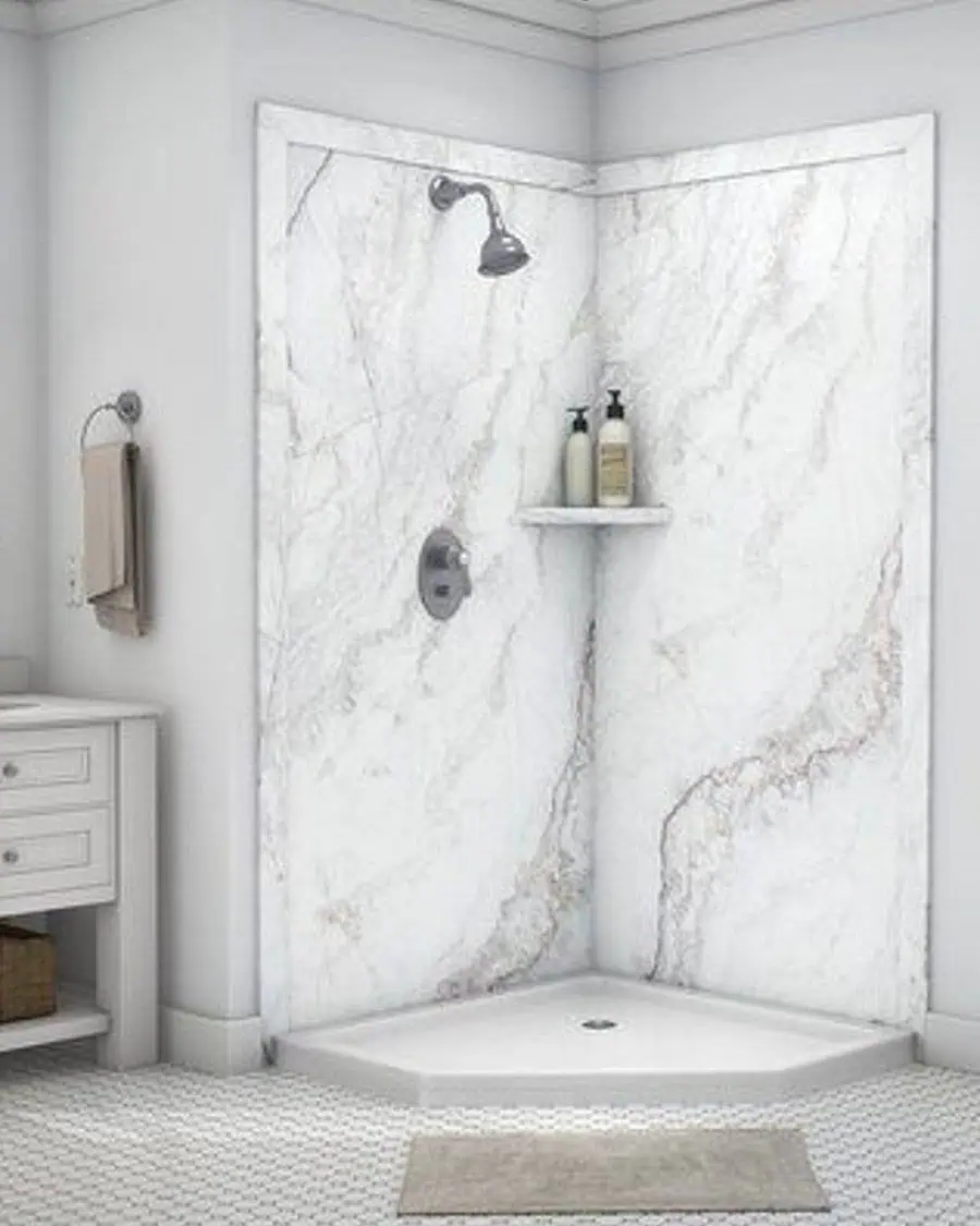 Country-style bathroom with marble-look shower walls, chrome fixtures, and white vanity for storage.