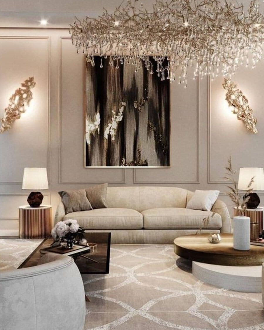 Elegant living room with abstract wall art, a modern chandelier, beige sofa, and stylish decor.