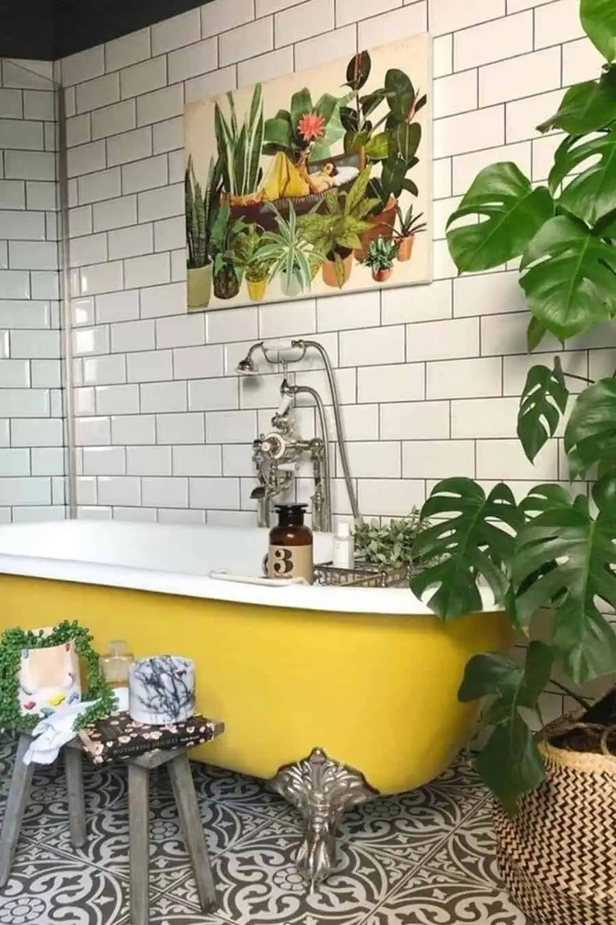 Eclectic bathroom with a yellow clawfoot tub, subway tile, and a large philodendron plant.