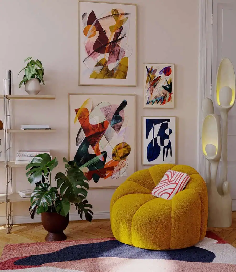 Abstract gallery wall with bold artwork, mustard accent chair, and modern decor elements