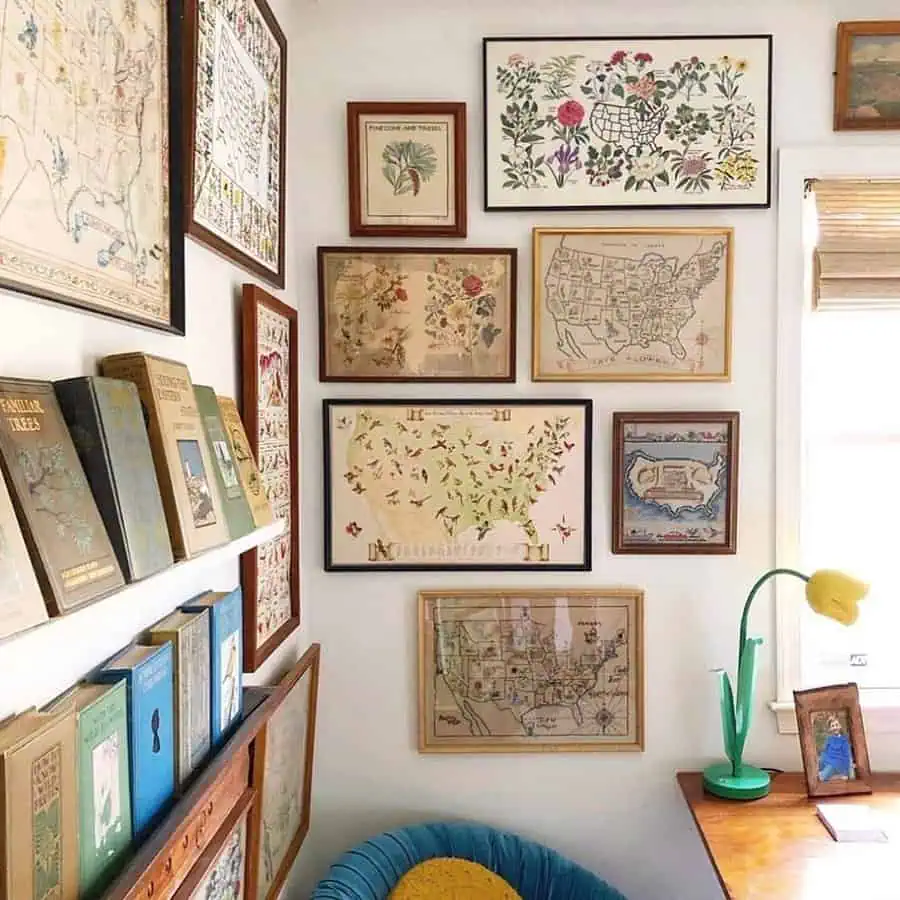 Vintage-inspired gallery wall with botanical and map prints, bookshelves, and a cozy reading nook.