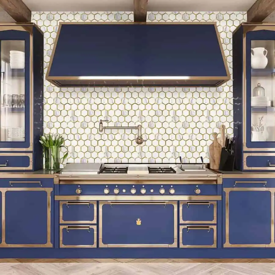 1950s kitchen with bold navy cabinets, gold accents, and honeycomb tile backsplash.