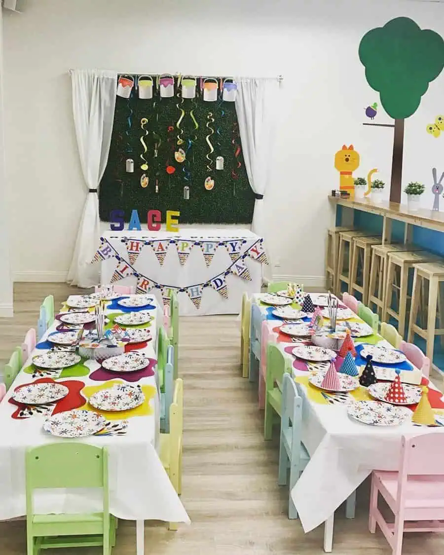 Art-themed kids' birthday party with colorful decorations, craft-inspired tables, and party hats.