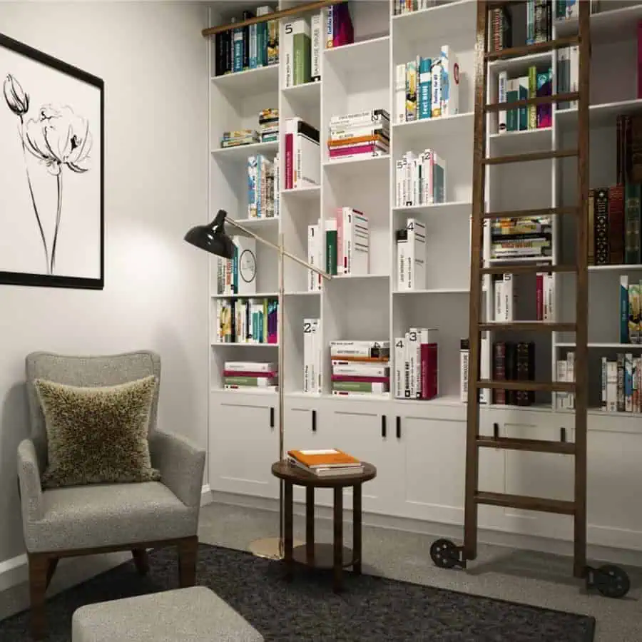 Cozy nook with built-in bookshelves, rolling ladder, armchair, and modern floor lamp.