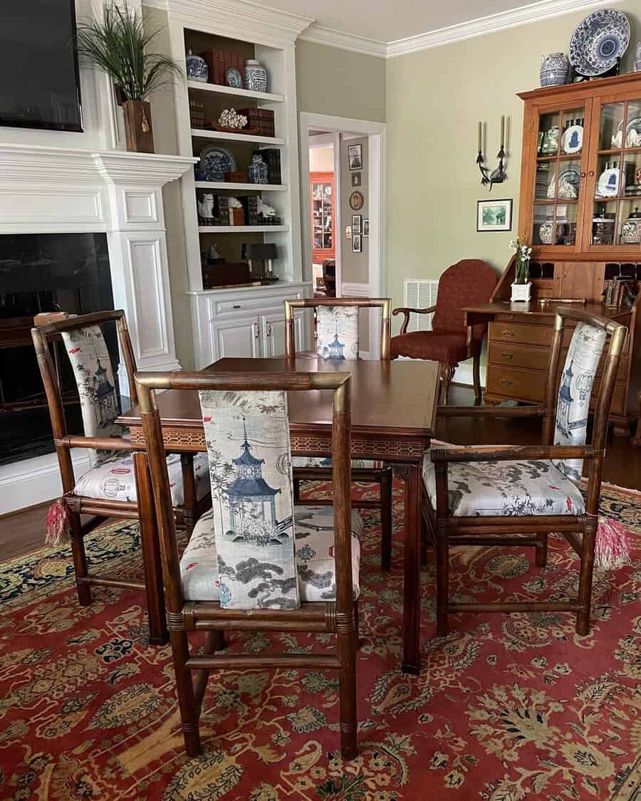 Traditional den with wooden furniture, patterned chairs, built-in shelves, and decorative accents.