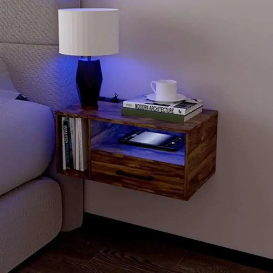 Floating wooden nightstand with built-in LED lighting and modern decor accessories.