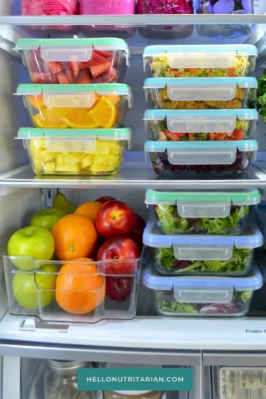 Fruits, salads, and prepped meals in glass containers neatly organized in the refrigerator.