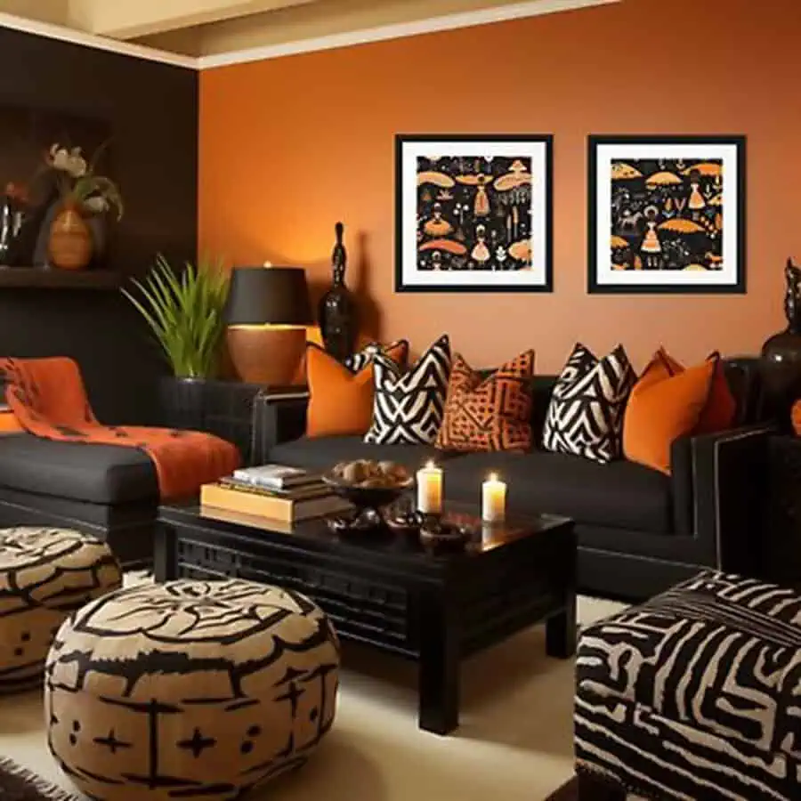 Modern den with orange walls, patterned cushions, tribal ottomans, and warm decorative accents.