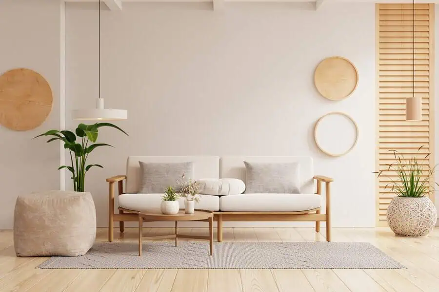 Scandinavian living room with wooden furniture, neutral tones, and simple wall decor.