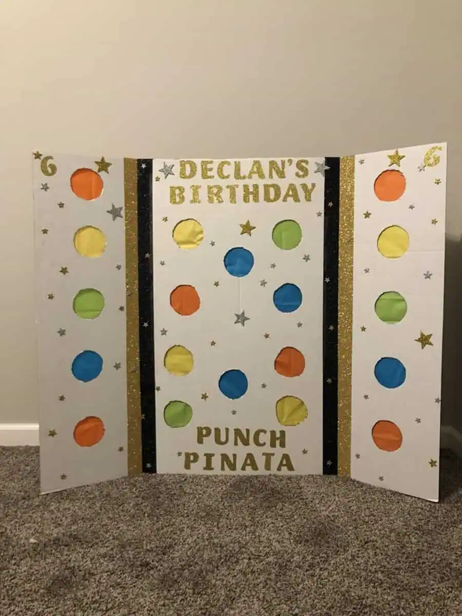 Punch pinata board with colorful circles for a fun birthday activity.