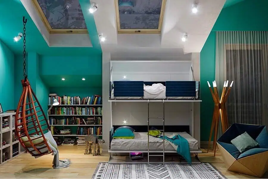 Space-saving den with bunk beds, teal walls, hanging chair, bookshelf, and modern lighting.