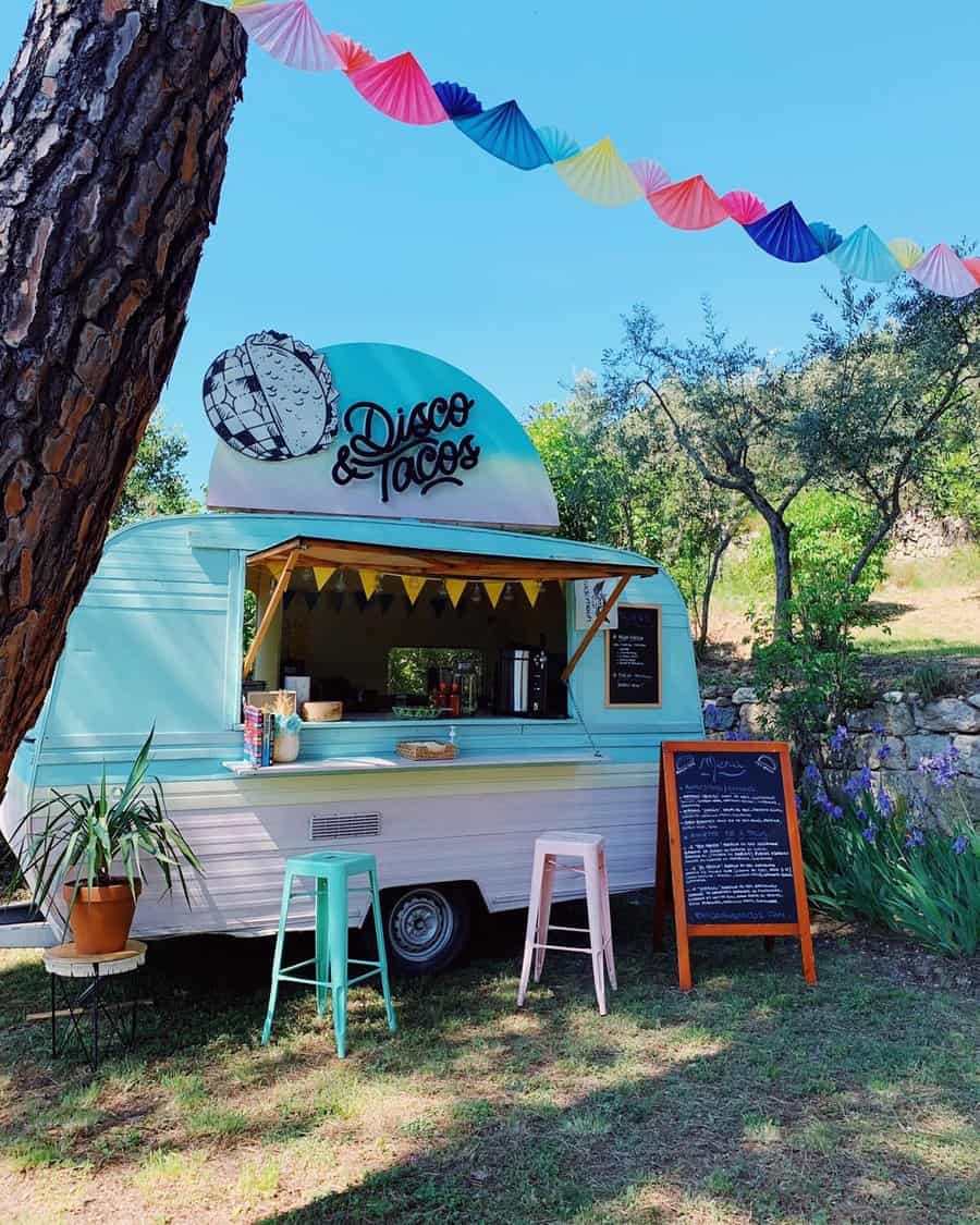 Taco truck-themed outdoor birthday party with colorful decor and seating.