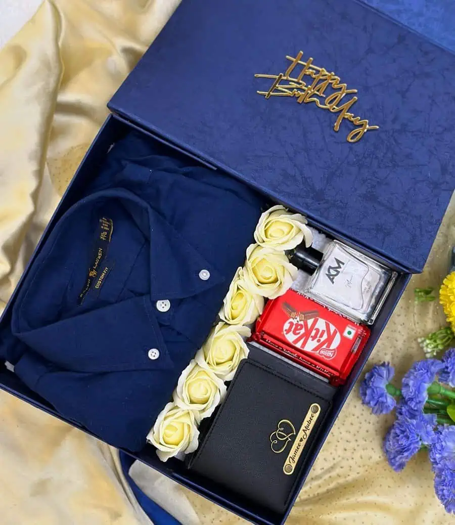 Unique birthday gift box with a shirt, wallet, chocolates, perfume, and decorative roses.