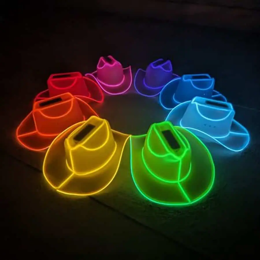 Neon glow cowboy hats in various colors arranged in a circle for a fun 20th birthday party.