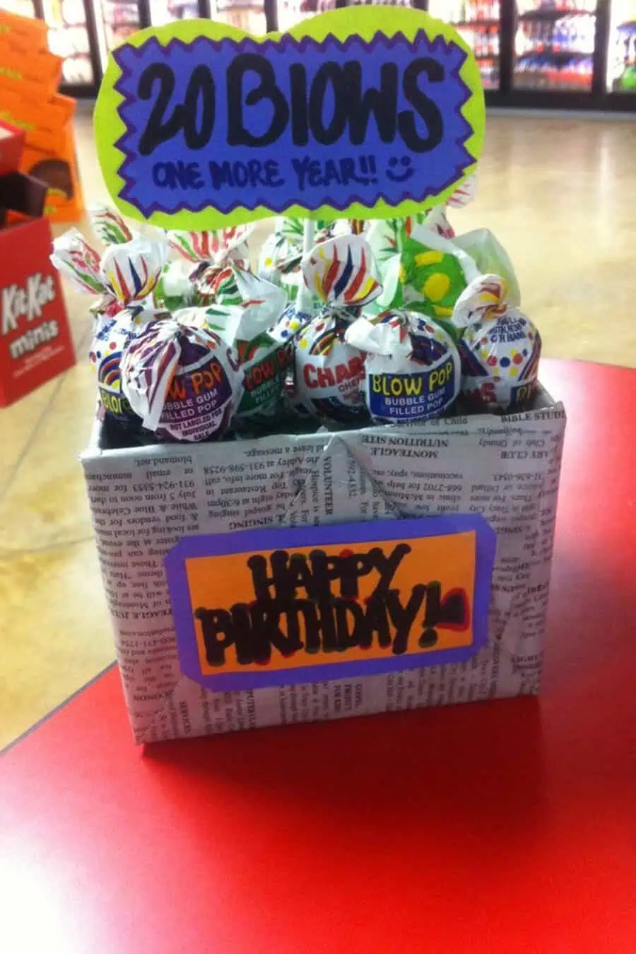 Creative "20 Blows" lollipop gift box for a fun 20th birthday idea.