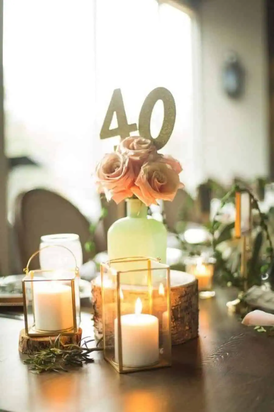 Elegant 40th birthday decor with roses and glowing candles.