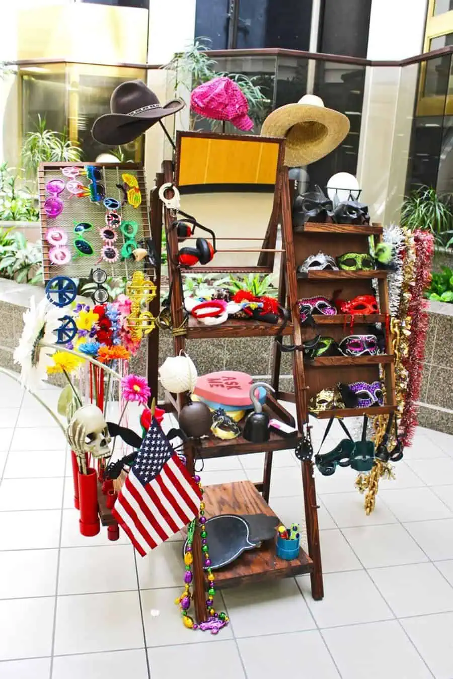 Creative prop station with hats, masks, and accessories for 40th birthday party fun.