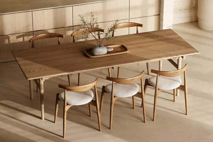 Chic dining table decor with natural wood, sleek chairs, and a minimalist centerpiece.