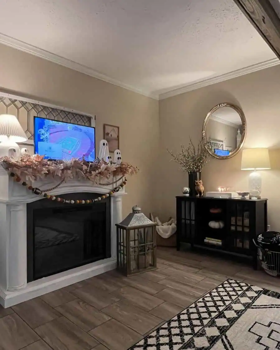 Living room with a round mirror, decorated fireplace, and cozy feng shui-inspired elements.