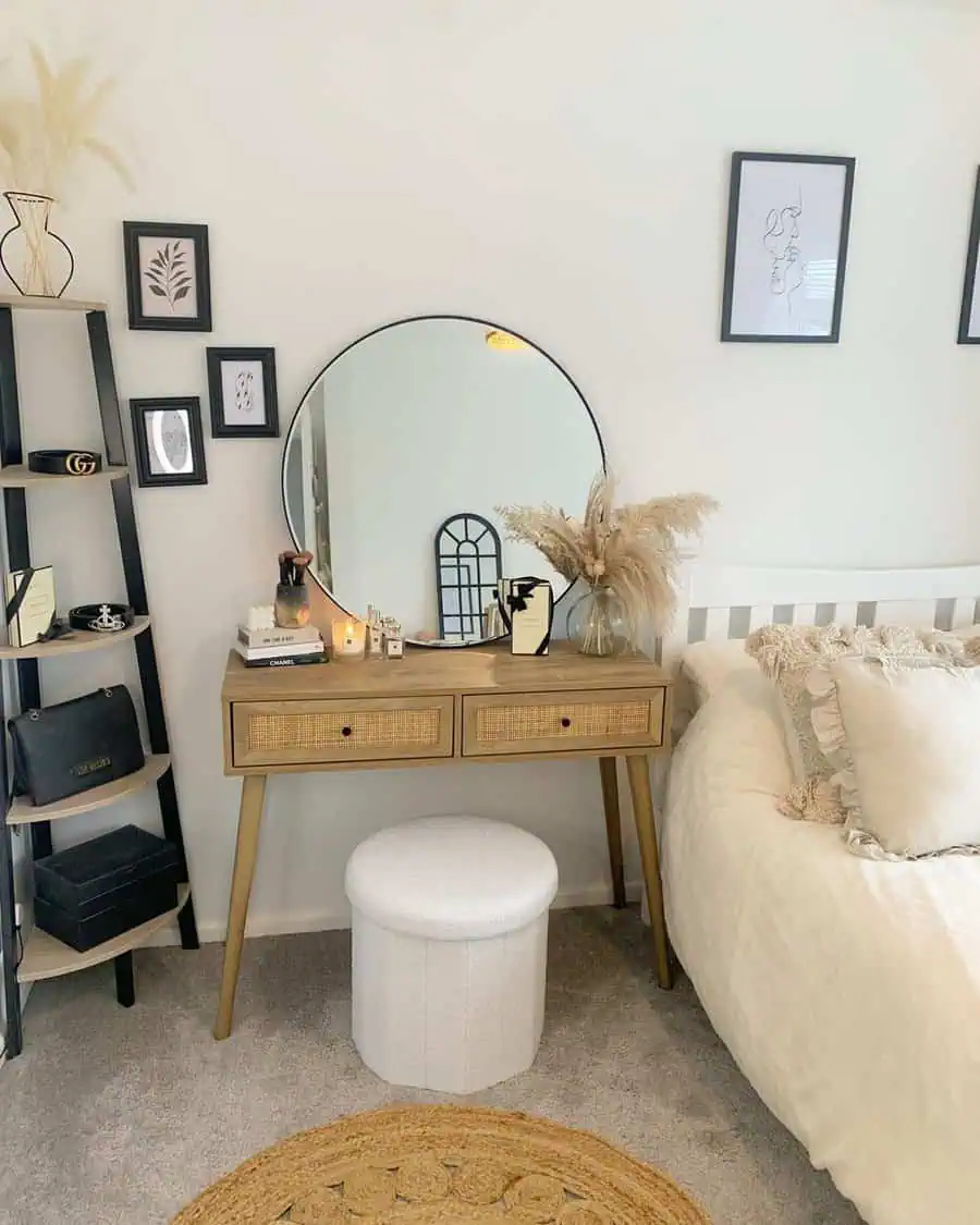 Boho bedroom vanity with round feng shui mirror, rattan accents, and minimalist decor.