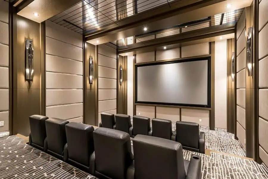 Modern home theater with sleek walls, cozy recliners, and ambient lighting.