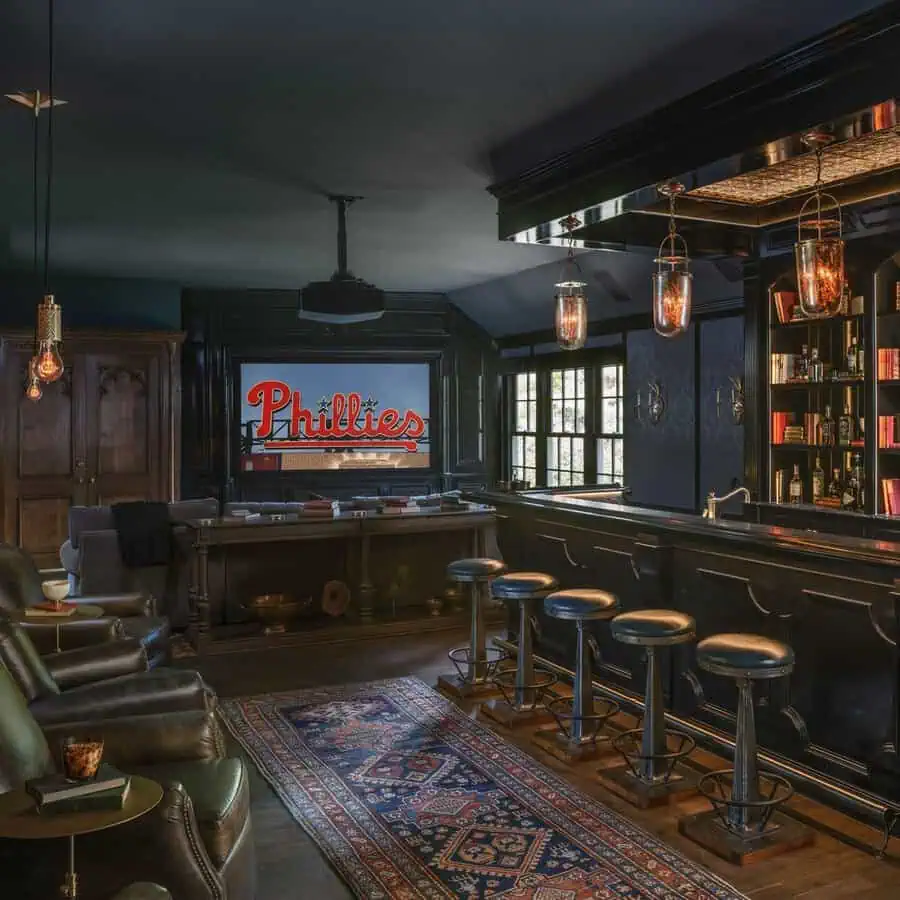 Vintage-inspired home theater with a stylish bar, cozy seating, and classic décor elements.