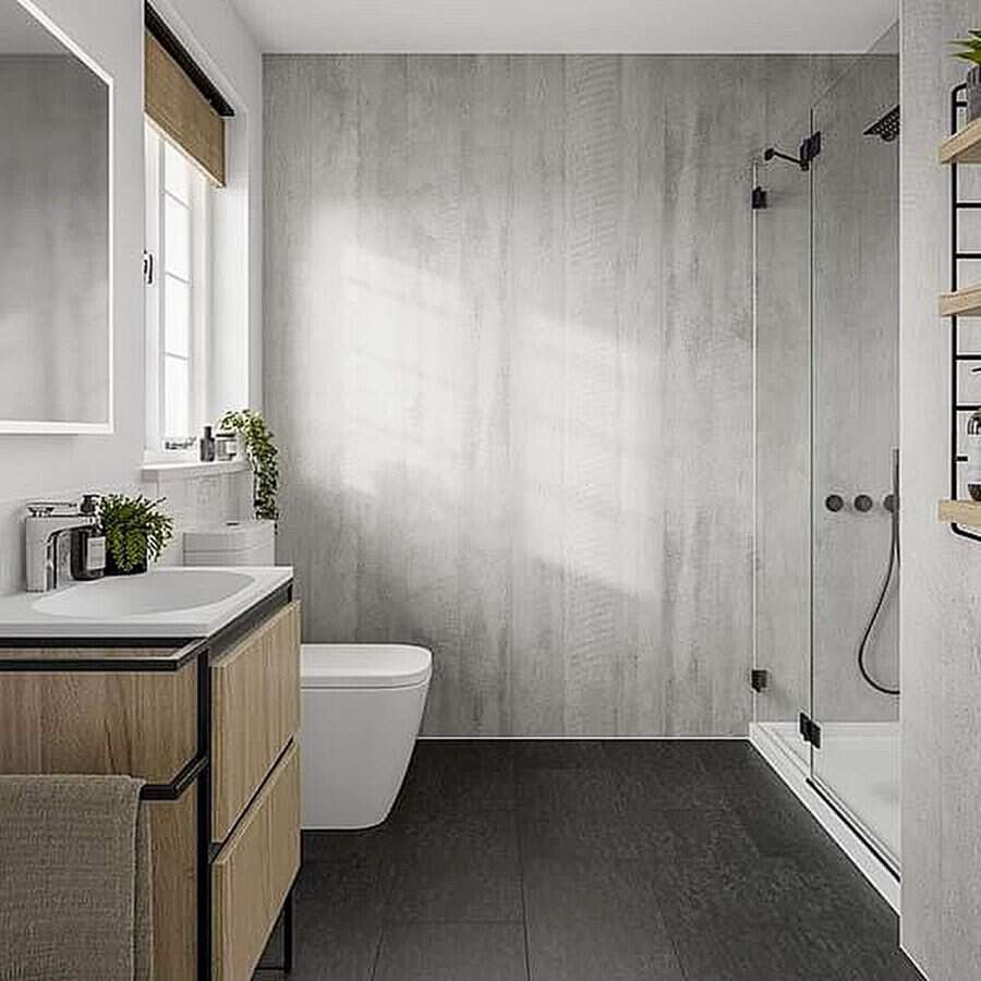 Bathroom with light grey walls and contrasting dark grey floor tiles.