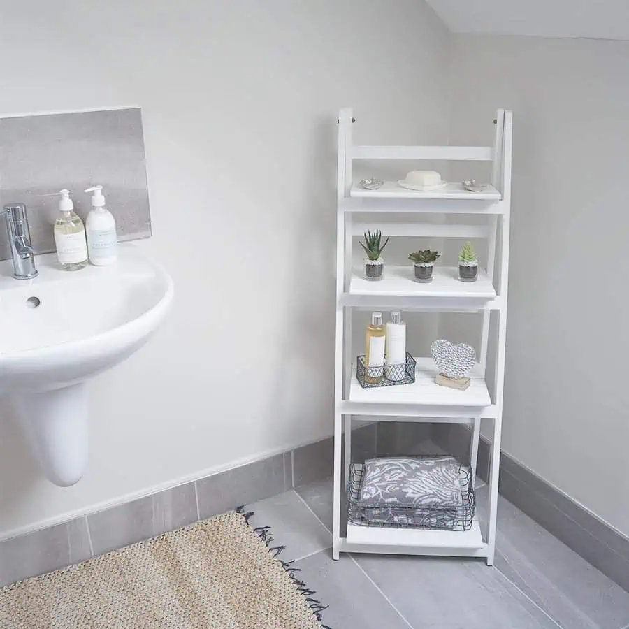 Bathroom with grey floor tiles, white walls, and neutral-toned accents for a clean look.