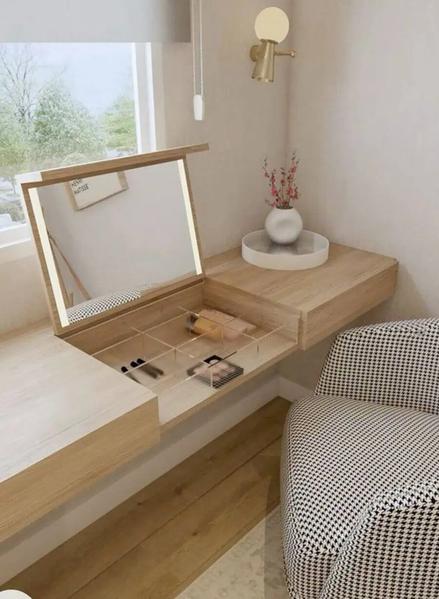 Scandinavian vanity setup with wooden desk, built-in mirror, and minimalist decor.