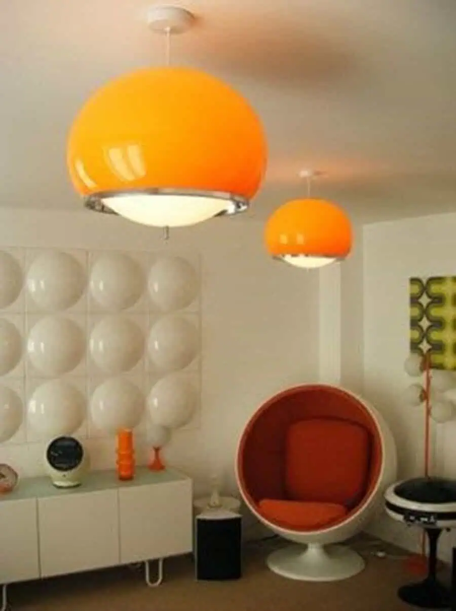 1960s space-age room with bold orange lighting, futuristic egg chair, and retro modern decor.